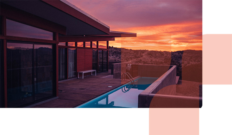 Newly renovated outdoor area of a house with sunset in the background