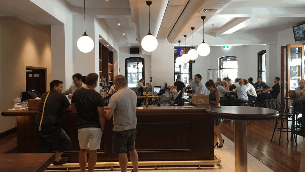 Port Office Hotel Front Bar with lots of people around | Featured Image for Tribella Group